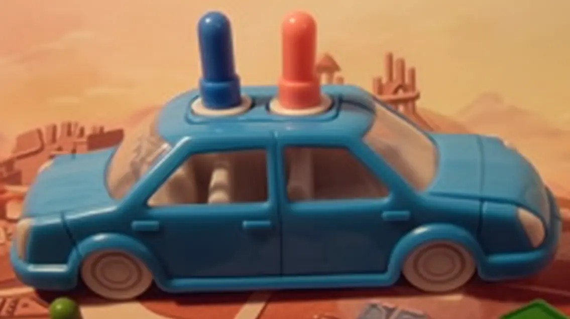 Weird plastic car with one blue and one pink peg, symbolising Family Trust Edition beneficiaries .